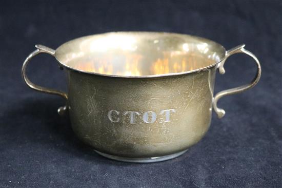 A 1920s silver two handled silver porringer engraved C.T.O.T., 160 grams.